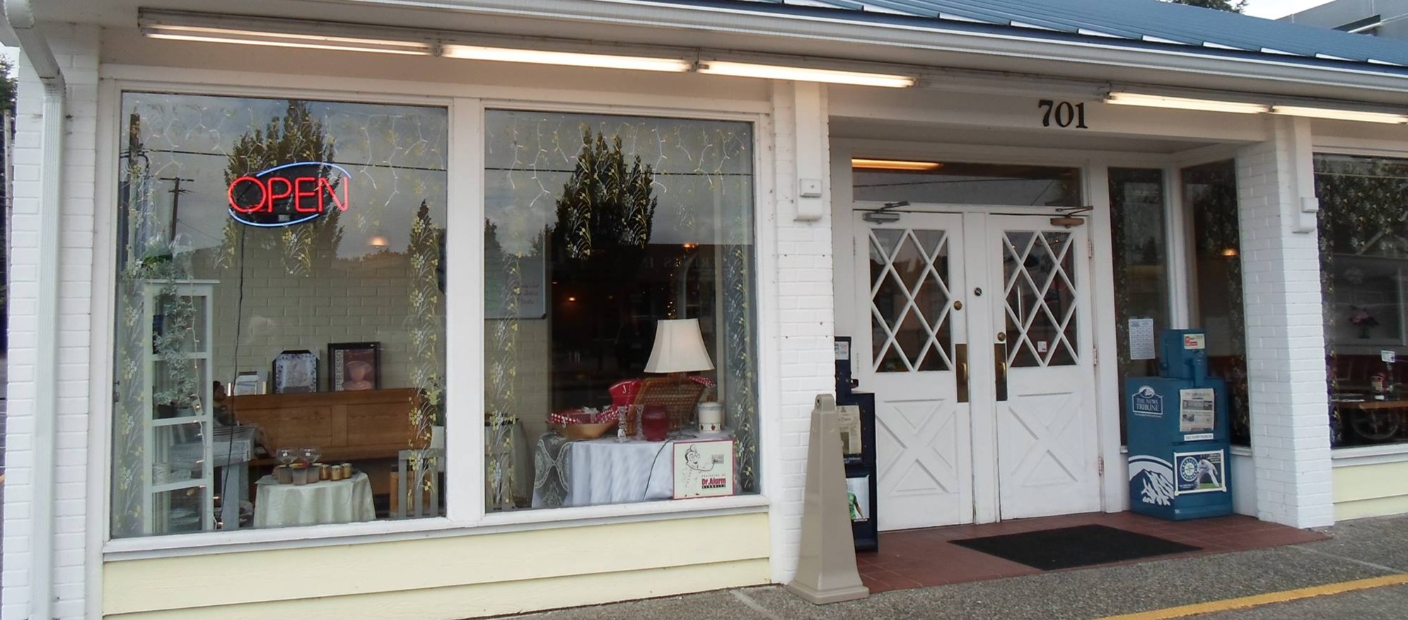 The open sign in the window at 701 East Main